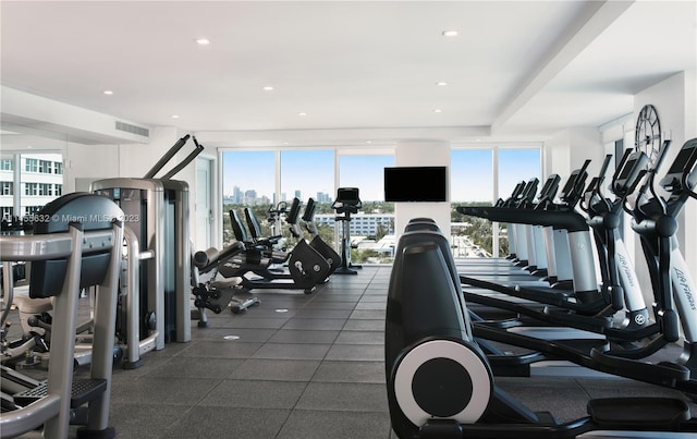 workout area with dark tile flooring