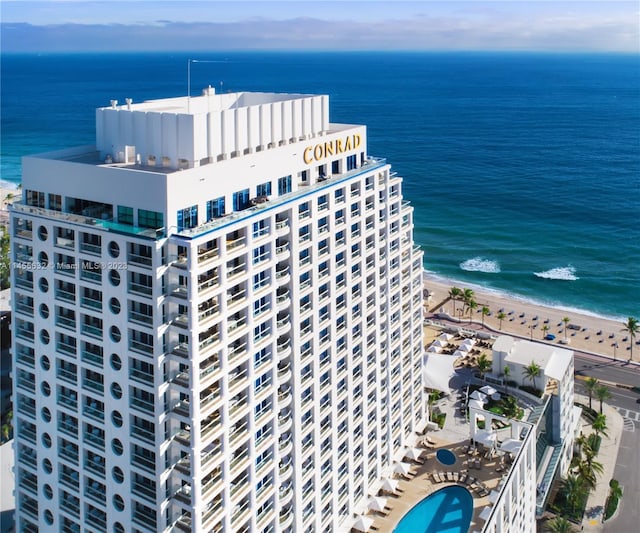 exterior space featuring a beach view and a water view