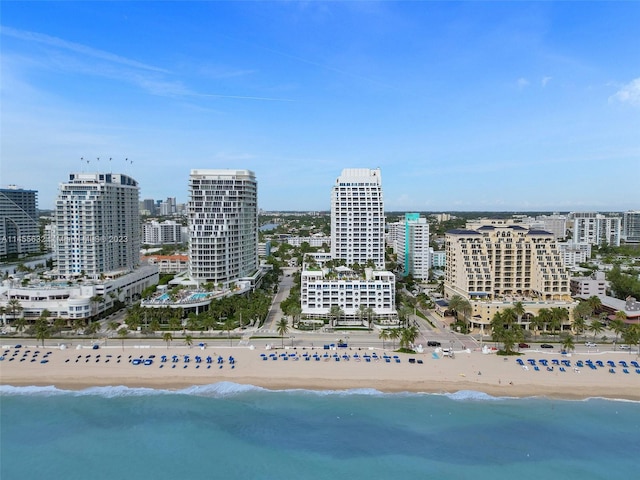 bird's eye view with a water view and a view of the beach