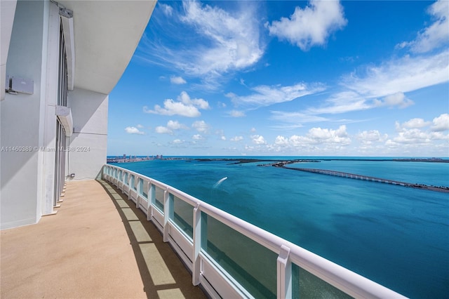 balcony featuring a water view