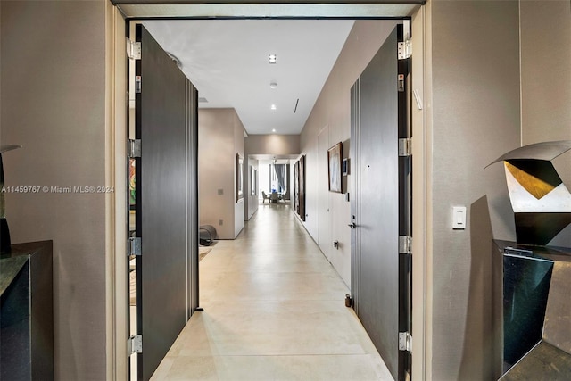 hallway featuring light tile floors