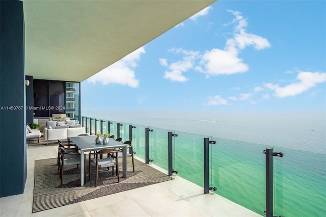 balcony featuring a water view