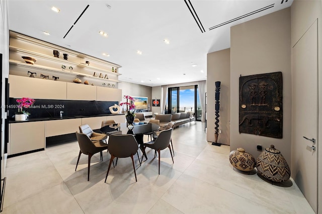 dining area with light tile floors and a wall mounted AC