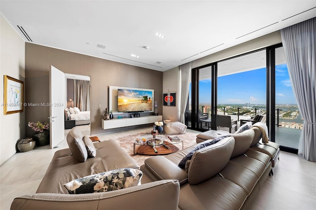 living room with light tile floors and expansive windows