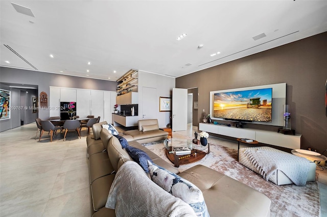 living room featuring light tile flooring