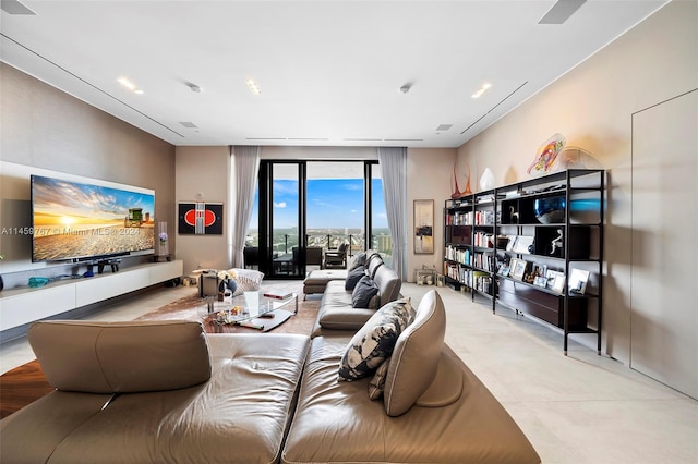 living room featuring a wall of windows