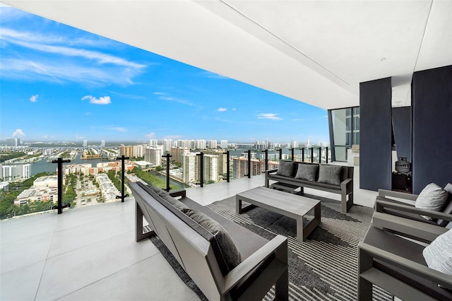 balcony featuring an outdoor hangout area and a water view