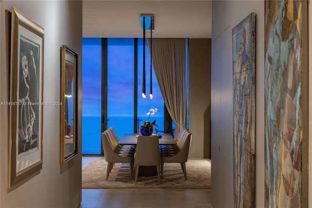 dining area with dark tile flooring