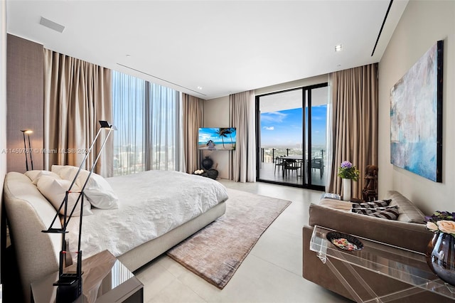 tiled bedroom with access to outside and a wall of windows