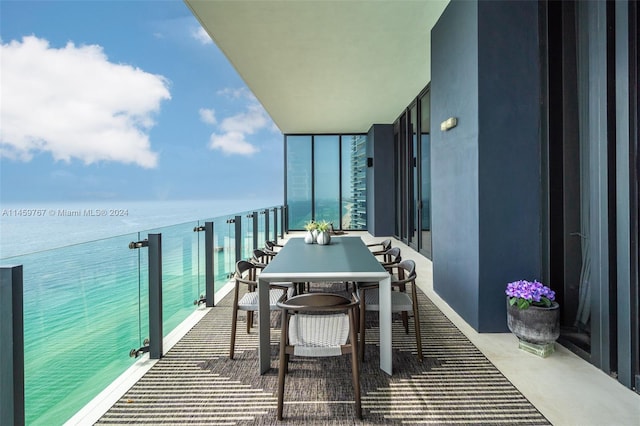 balcony featuring a water view