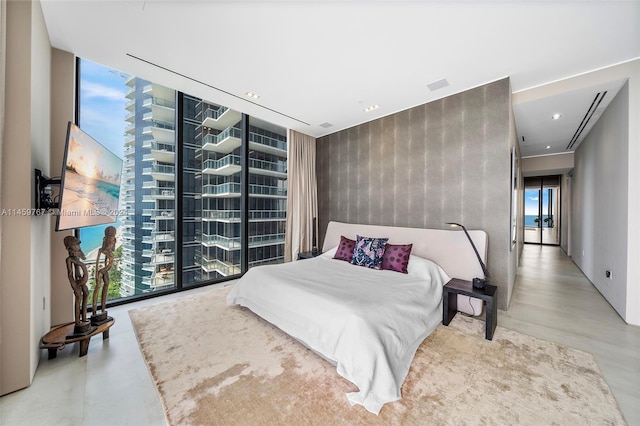 bedroom featuring floor to ceiling windows