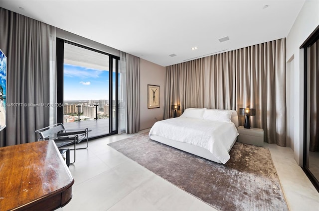 bedroom featuring light tile floors and access to outside