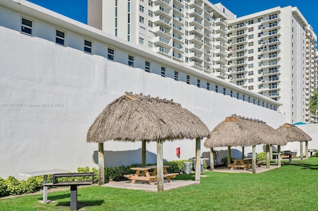 view of property's community featuring a gazebo and a lawn