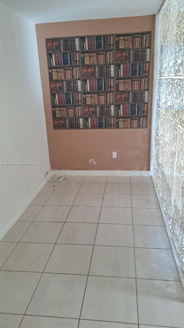 spare room featuring light tile floors