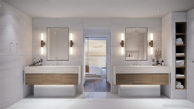 bathroom featuring tile walls, vanity with extensive cabinet space, and tile flooring