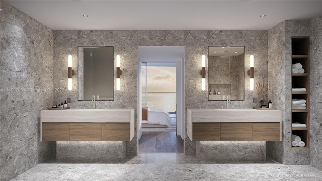 bathroom featuring tile walls, oversized vanity, and built in features