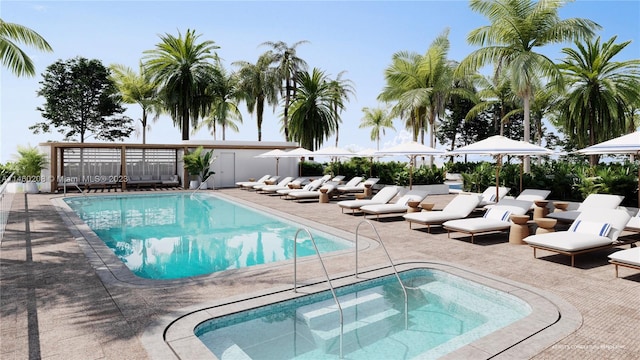 view of swimming pool with an in ground hot tub and a patio area