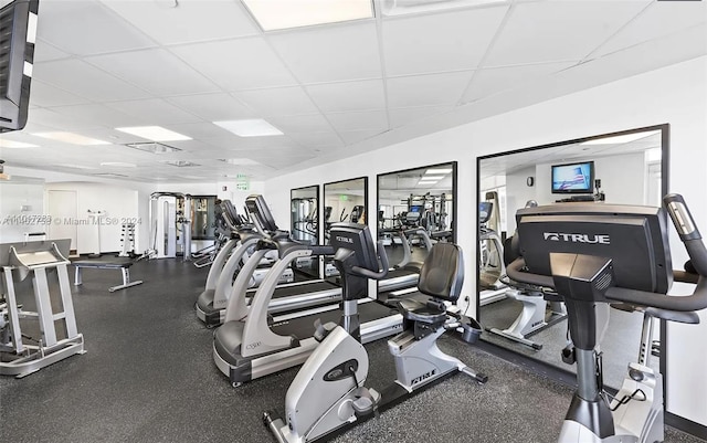 exercise room featuring a paneled ceiling