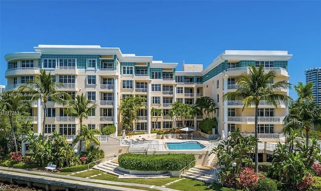 view of building exterior with a community pool