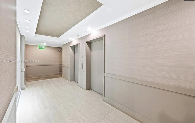 hallway featuring light tile flooring and elevator