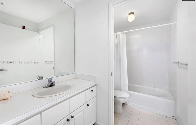 full bathroom with shower / bath combination with curtain, tile flooring, vanity with extensive cabinet space, and toilet