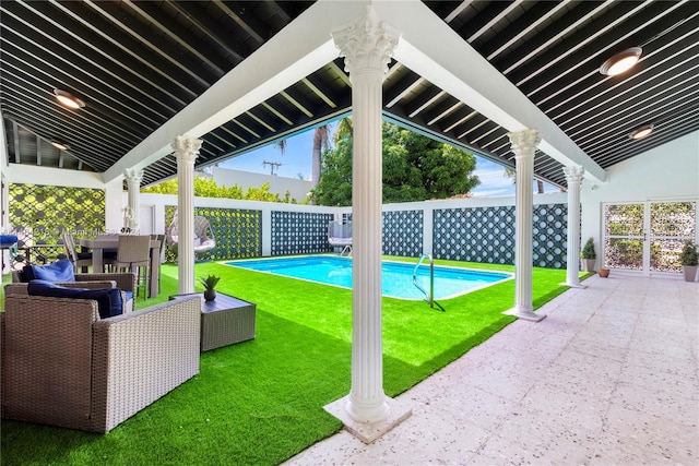 view of pool featuring a lawn, outdoor lounge area, and a patio