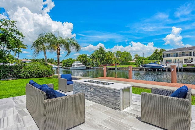 view of patio / terrace featuring a water view and a dock