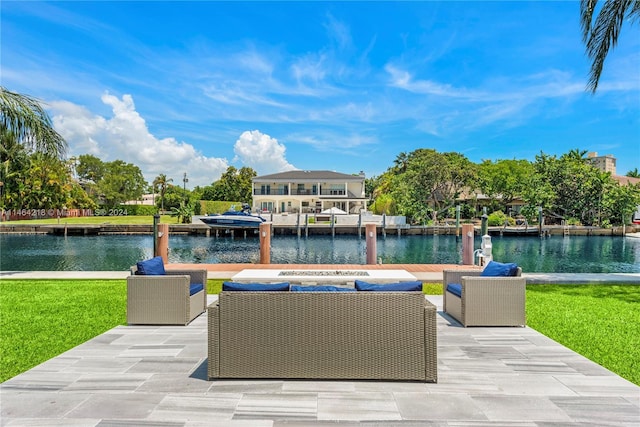 view of patio / terrace featuring an outdoor living space, a dock, and a water view