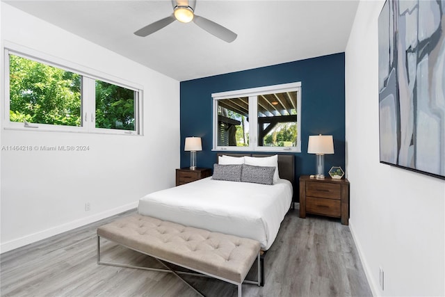 bedroom featuring light hardwood / wood-style floors and ceiling fan