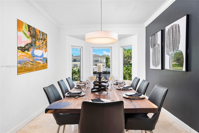 dining room with light tile patterned floors and ornamental molding