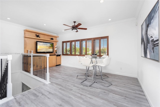 dining space with ceiling fan, ornamental molding, and wood-type flooring