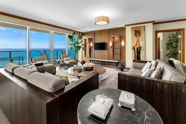 living room with crown molding and a water view