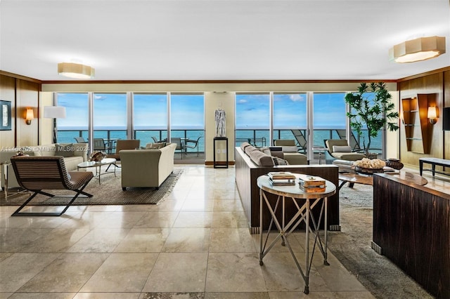 tiled living room with wooden walls, ornamental molding, and a water view