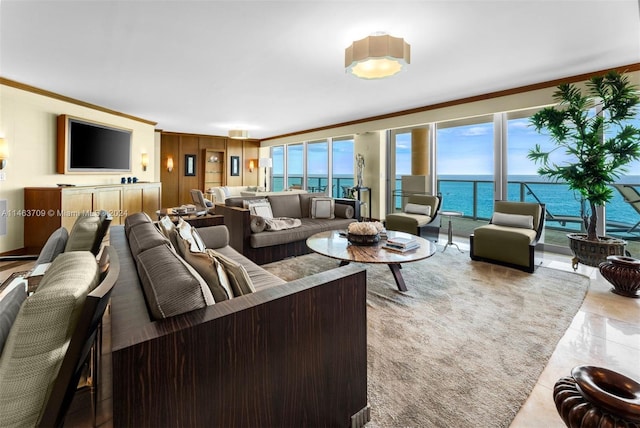 living room featuring a water view, ornamental molding, and light tile floors