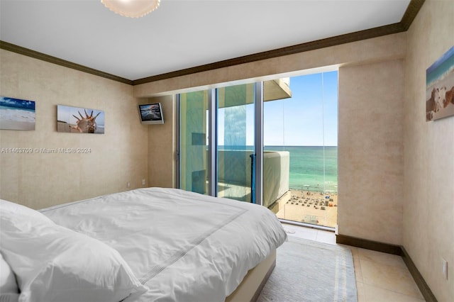 tiled bedroom with ornamental molding, multiple windows, access to exterior, and a water view