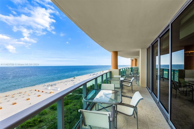 balcony with a view of the beach and a water view