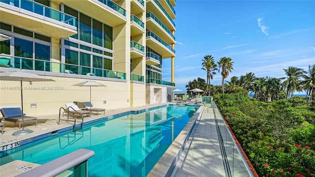 view of swimming pool featuring a patio area