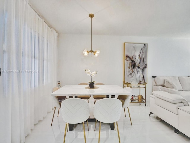 tiled dining room featuring a notable chandelier