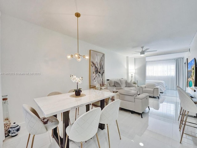 dining space featuring light tile floors and ceiling fan with notable chandelier