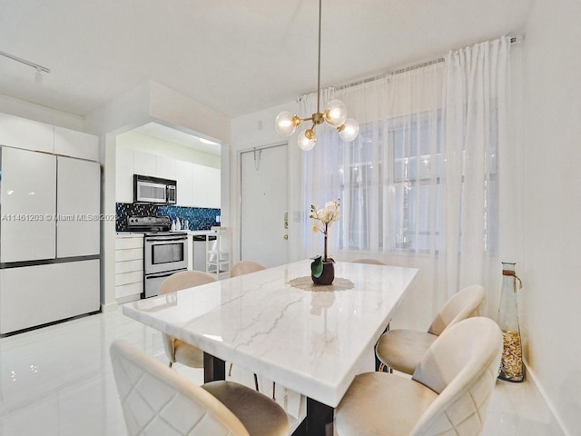 dining area featuring a chandelier