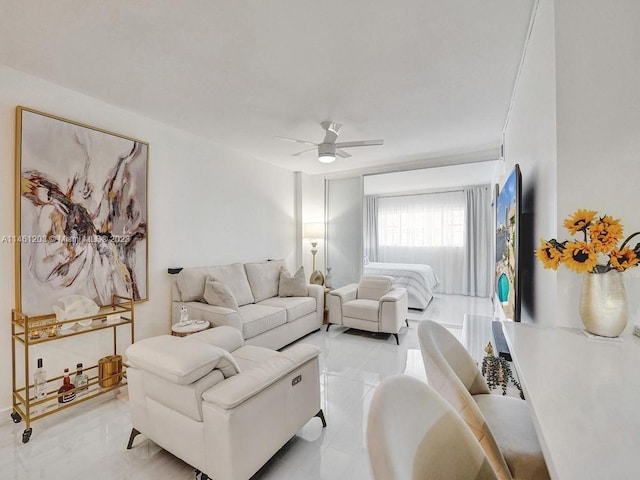 tiled living room featuring ceiling fan