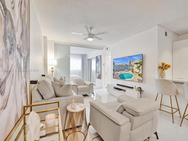 living room featuring ceiling fan and light tile floors