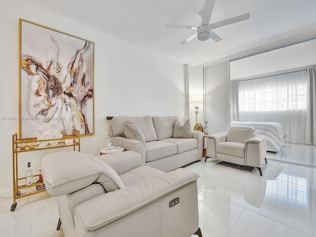 tiled living room with ceiling fan