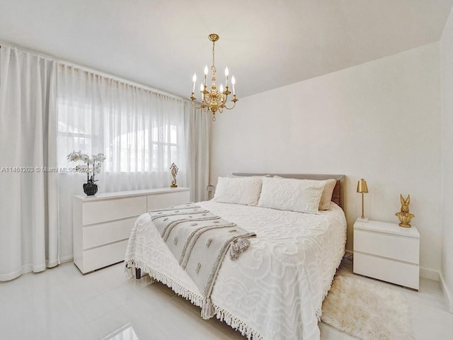 bedroom featuring a notable chandelier