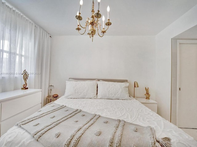 bedroom with a notable chandelier