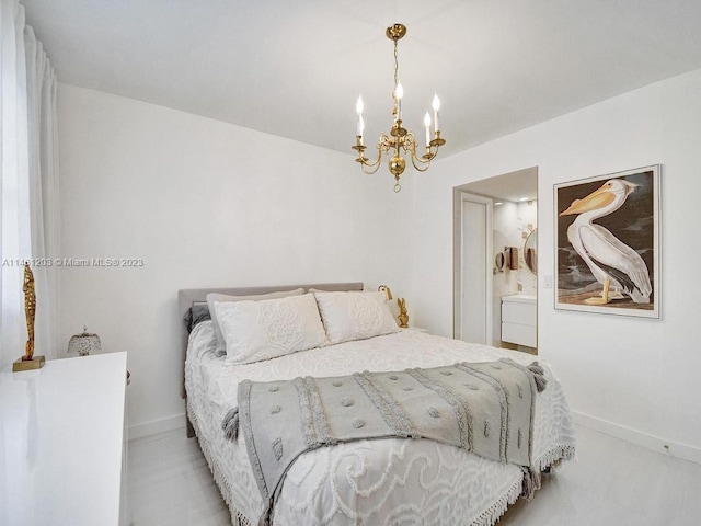 bedroom featuring a notable chandelier