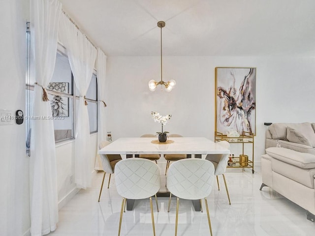 tiled dining space with a notable chandelier