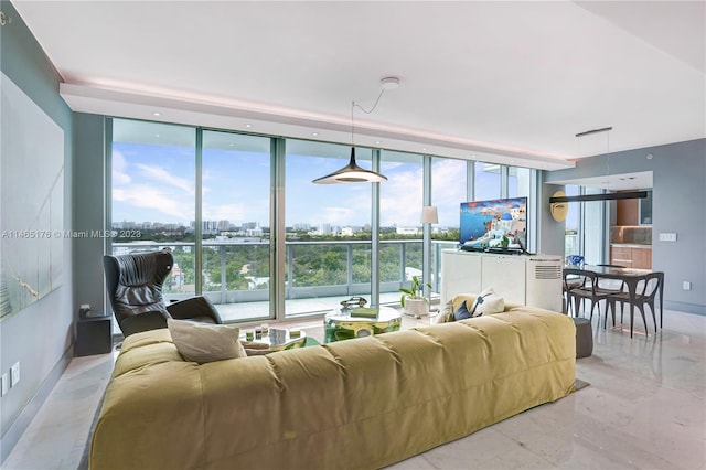 tiled living room featuring floor to ceiling windows