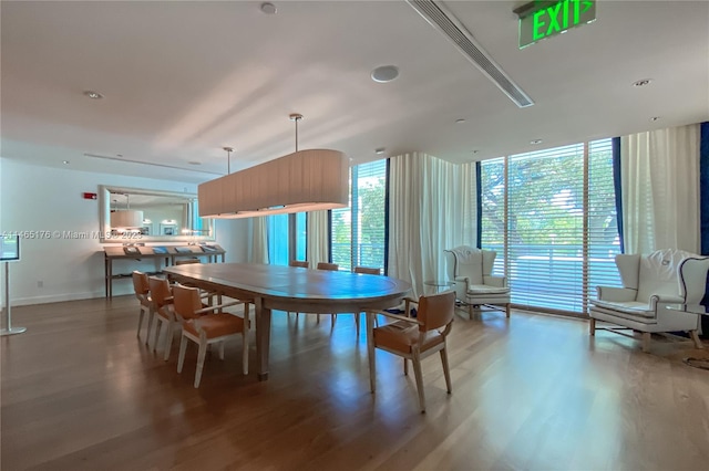 dining room with hardwood / wood-style flooring