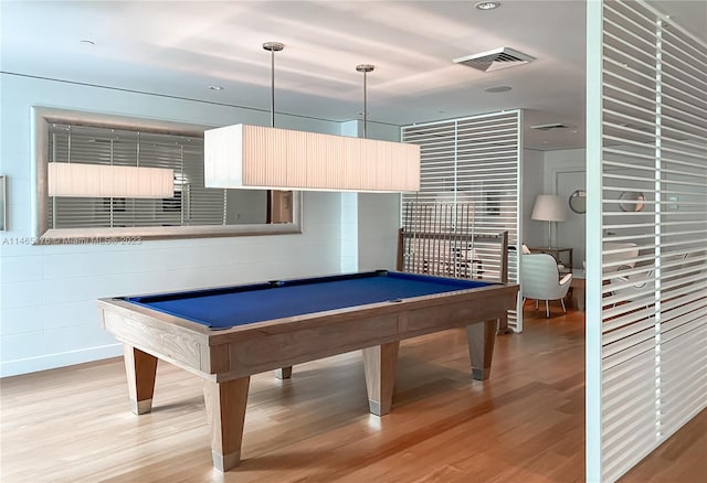 rec room with billiards and light hardwood / wood-style floors